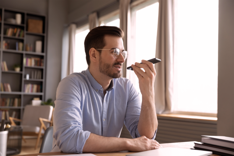 Man using his mobile phone to dictate clinical documentation